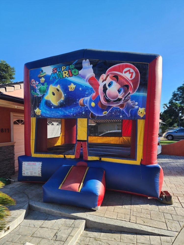 A bouncy house with a picture of mario on it
