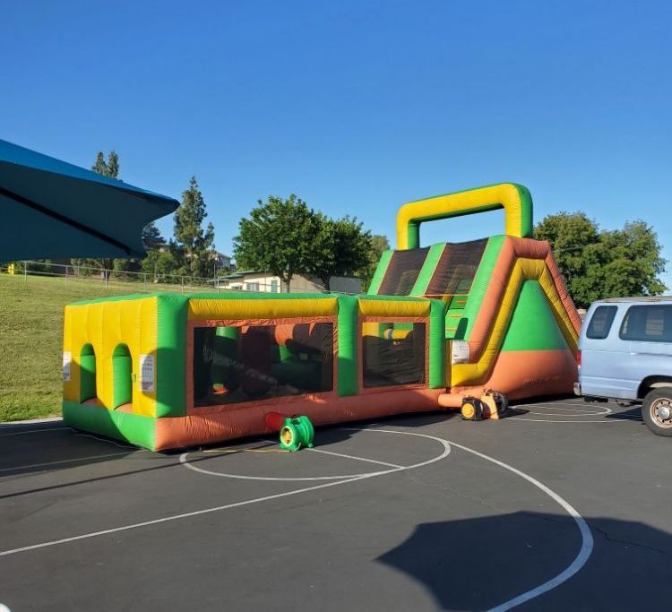 A large bouncy house is parked in a parking lot
