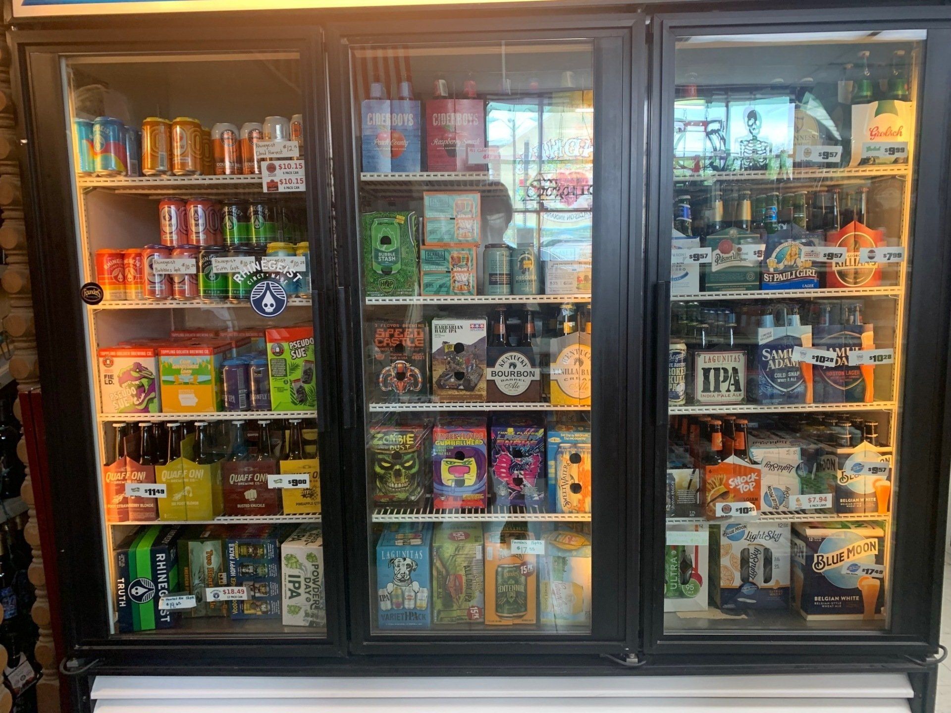 A refrigerator filled with lots of drinks and snacks.