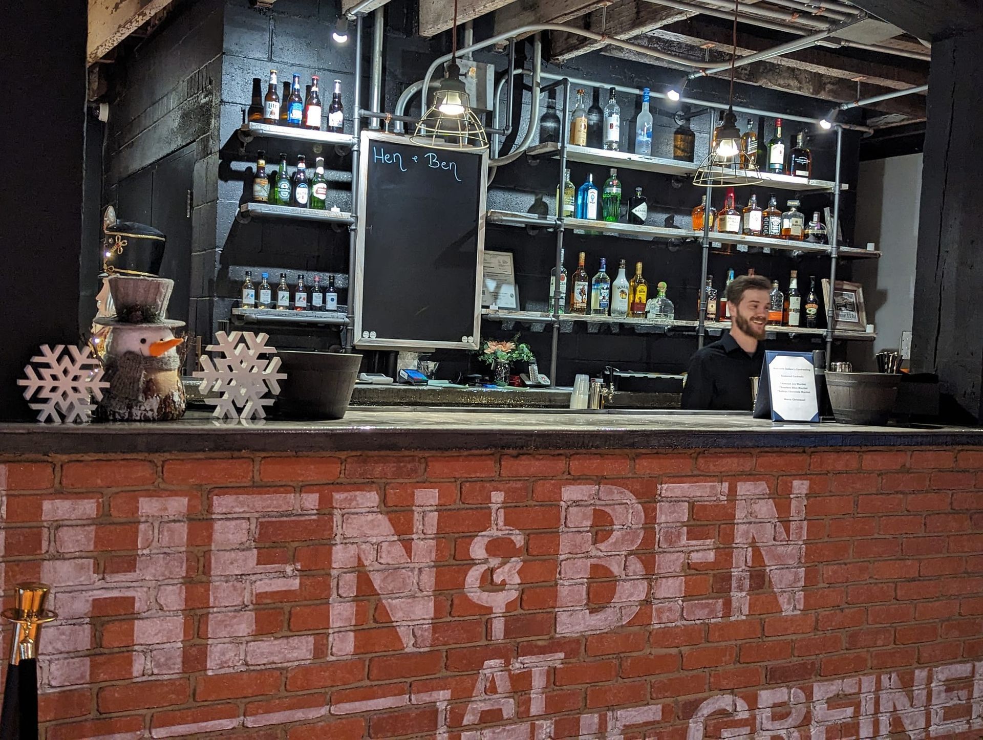 A bar with a sign that says hen & ben