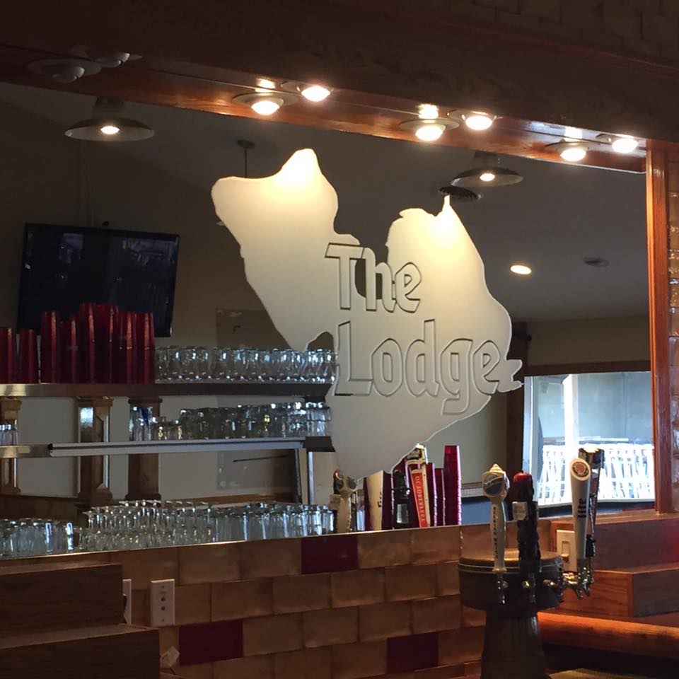 A restaurant with a sign that says the lodge