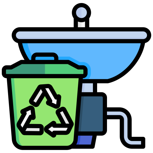 A green trash can with a recycling symbol next to a sink.