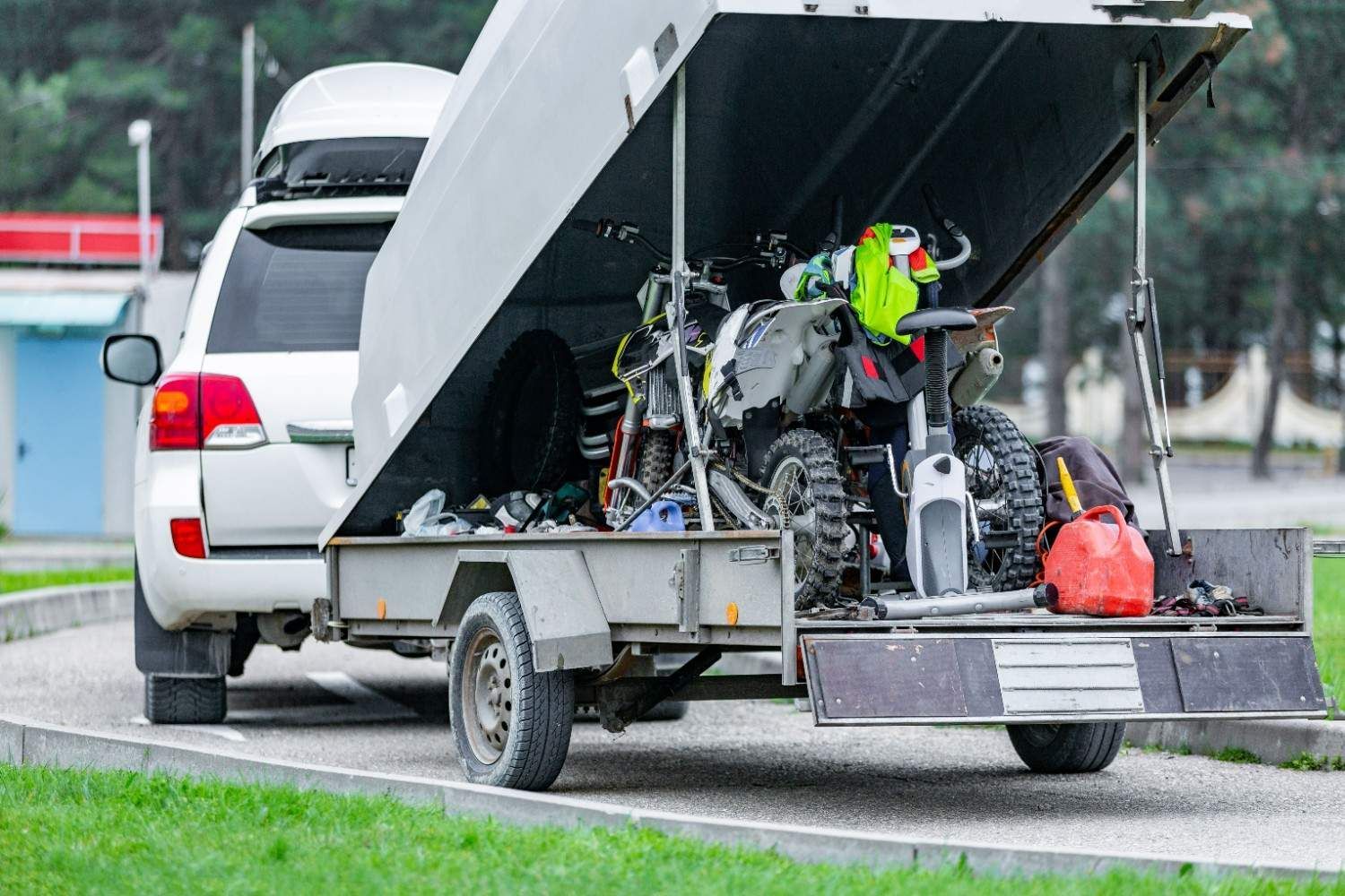 White Suv Towing a Trailer with A Motorcycle — A1 Towing in Blue Haven, NSW