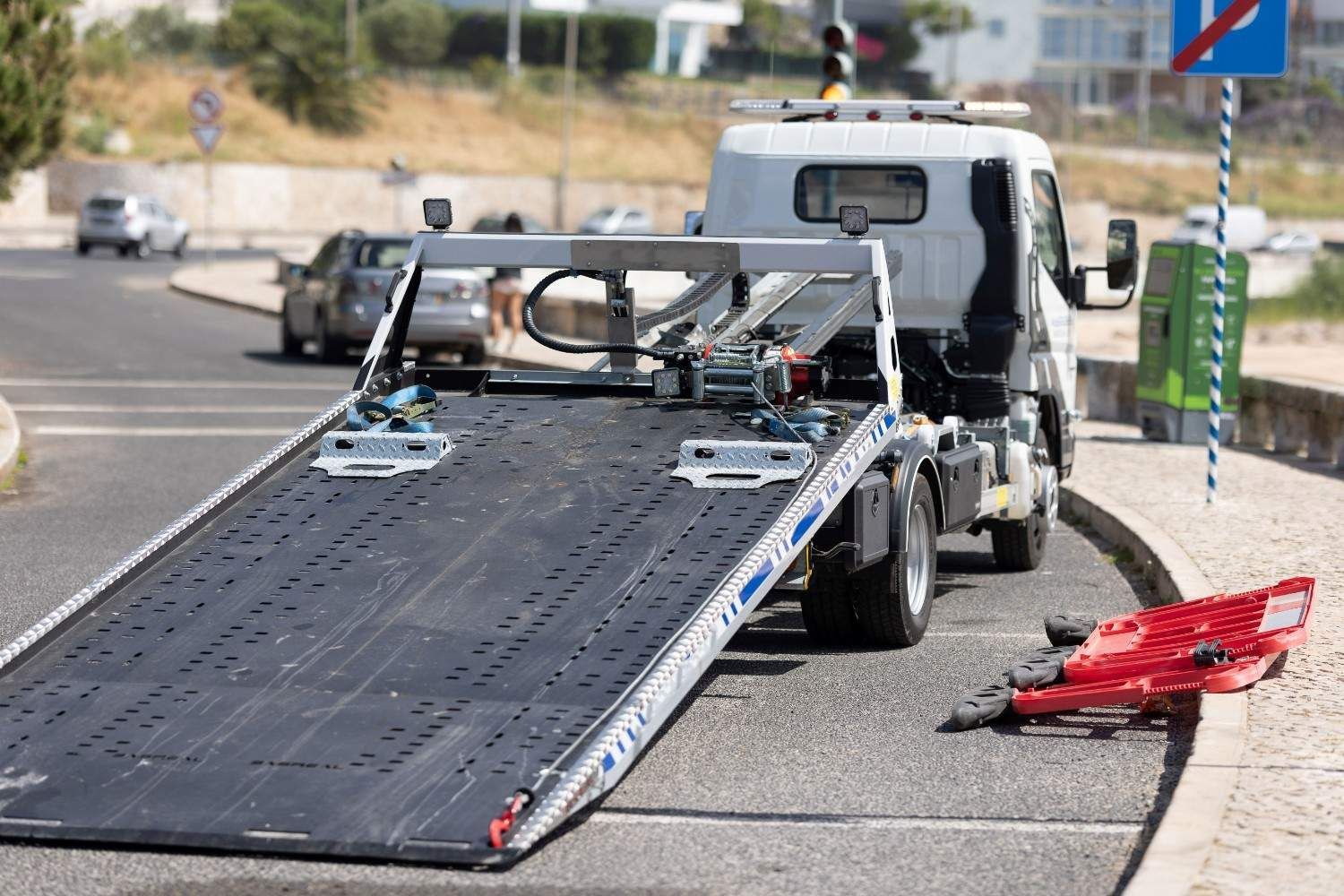 A Broken Car Bumper Lies Beside It — A1 Towing in Blue Haven, NSW