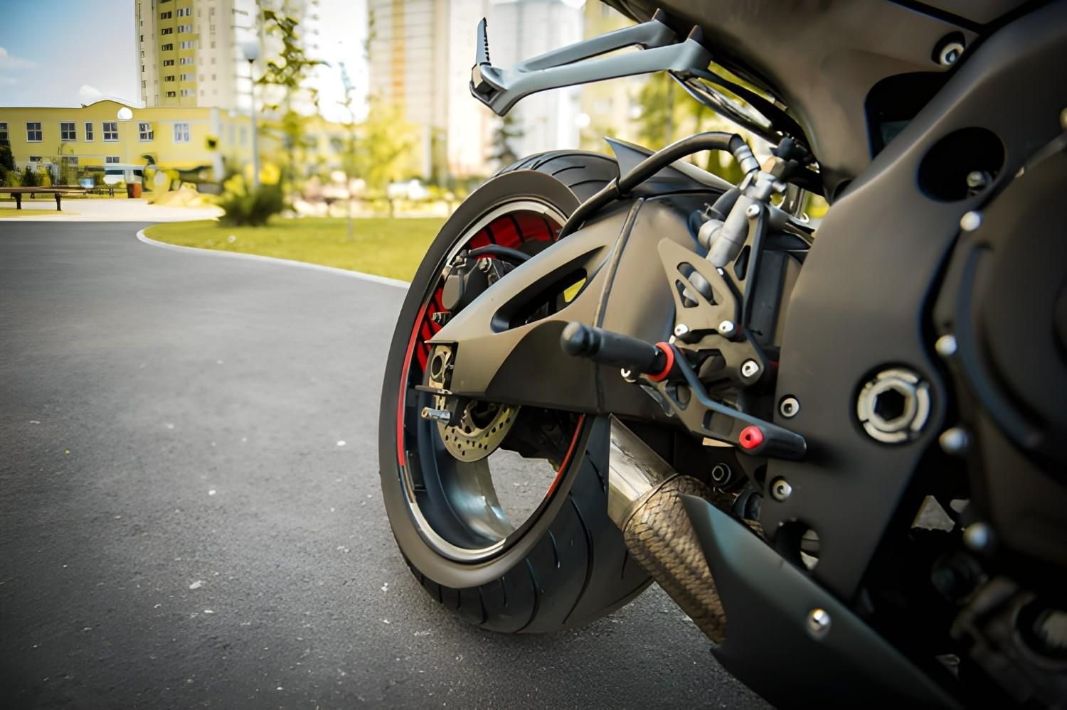 A Black Motorcycle Rear Tire and Engine Details — A1 Towing in Lake Macquarie, NSW