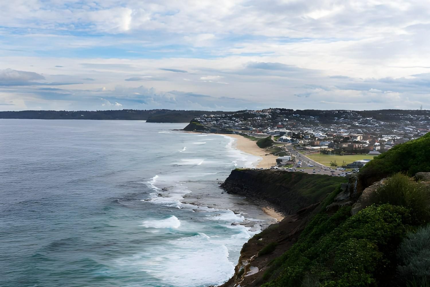 Ocean Waves Crash Against Rocky Cliffs — A1 Towing in Newcastle, NSW