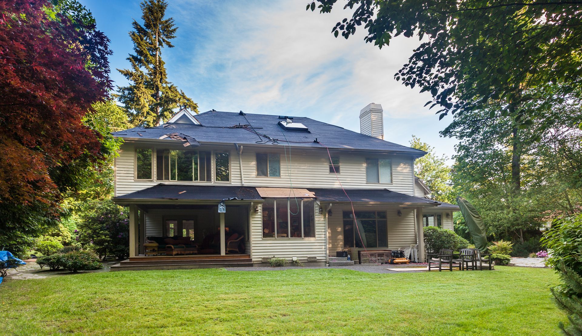 Suburban home in the middle of roof replacement.