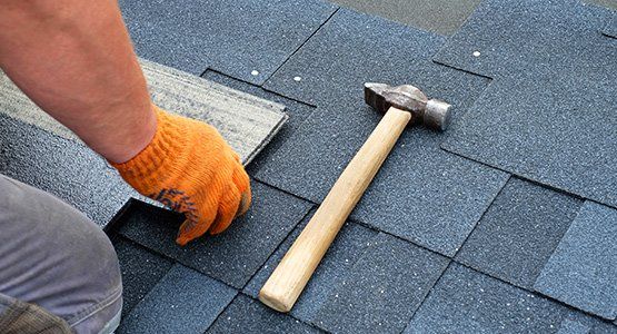 Contractor installing roof shingles — Raymore, MO — Meissen & Sons Roofing