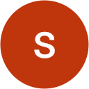 The letter s is in a red circle on a white background.