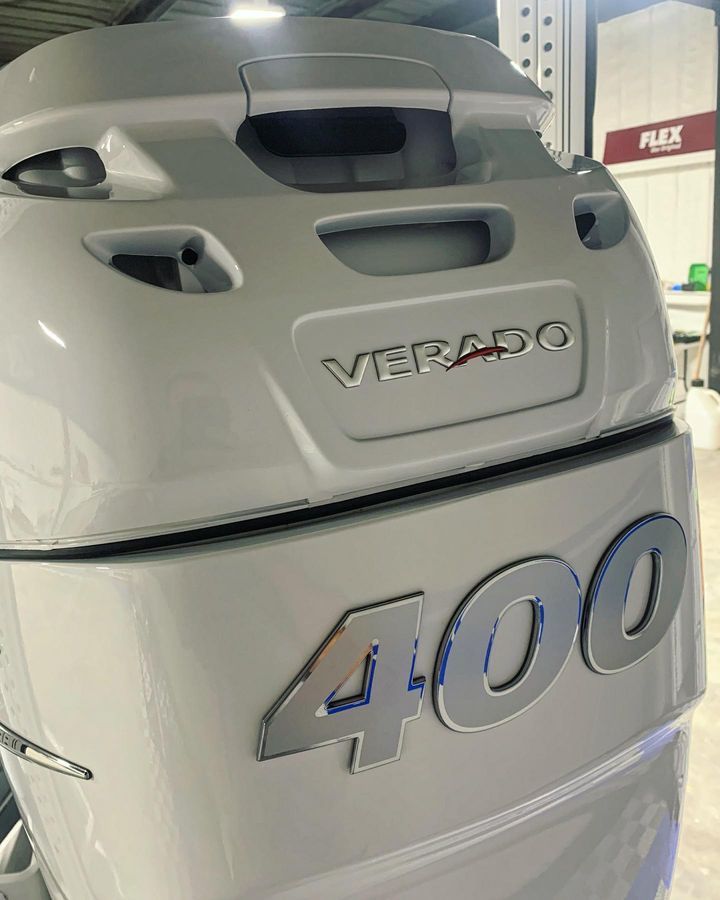White Mercury Verado 400 outboard motor. Features the
