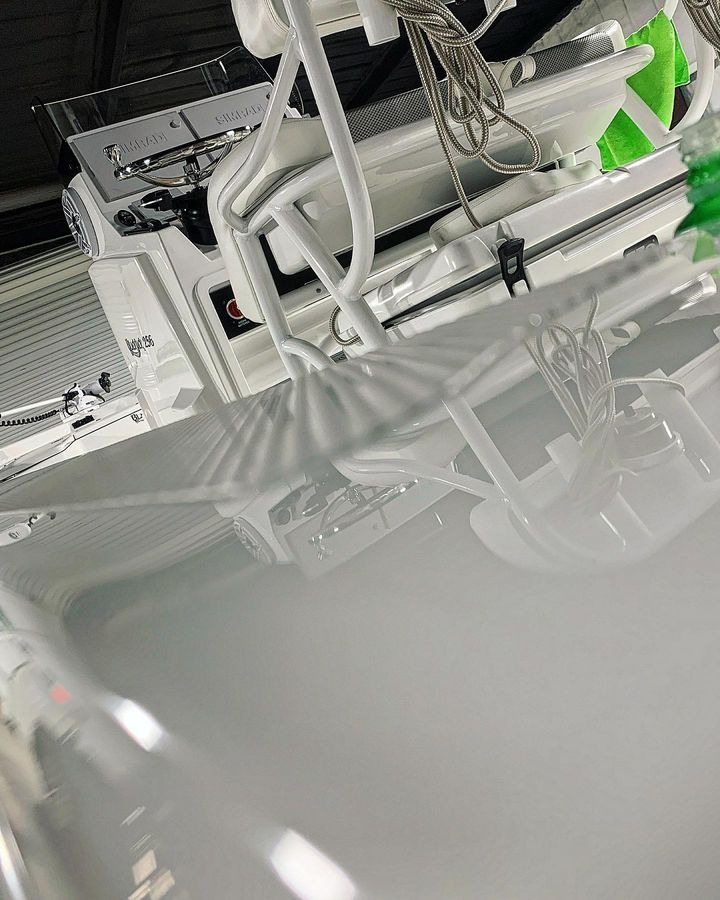 Medical equipment, overhead view. White machinery, cords, and some green accents.