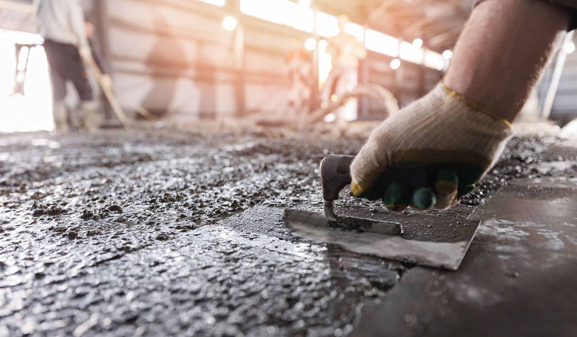 Hand Troweling Wet Concrete Floor, Worker in Gloves — Atherton Tableland Concreting in Upper Barron, QLD