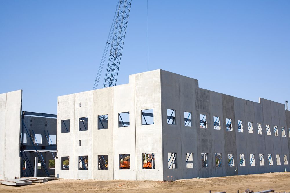 Concrete Walls With Square Window Openings and a Crane — Atherton Tableland Concreting in Yungaburra, QLD