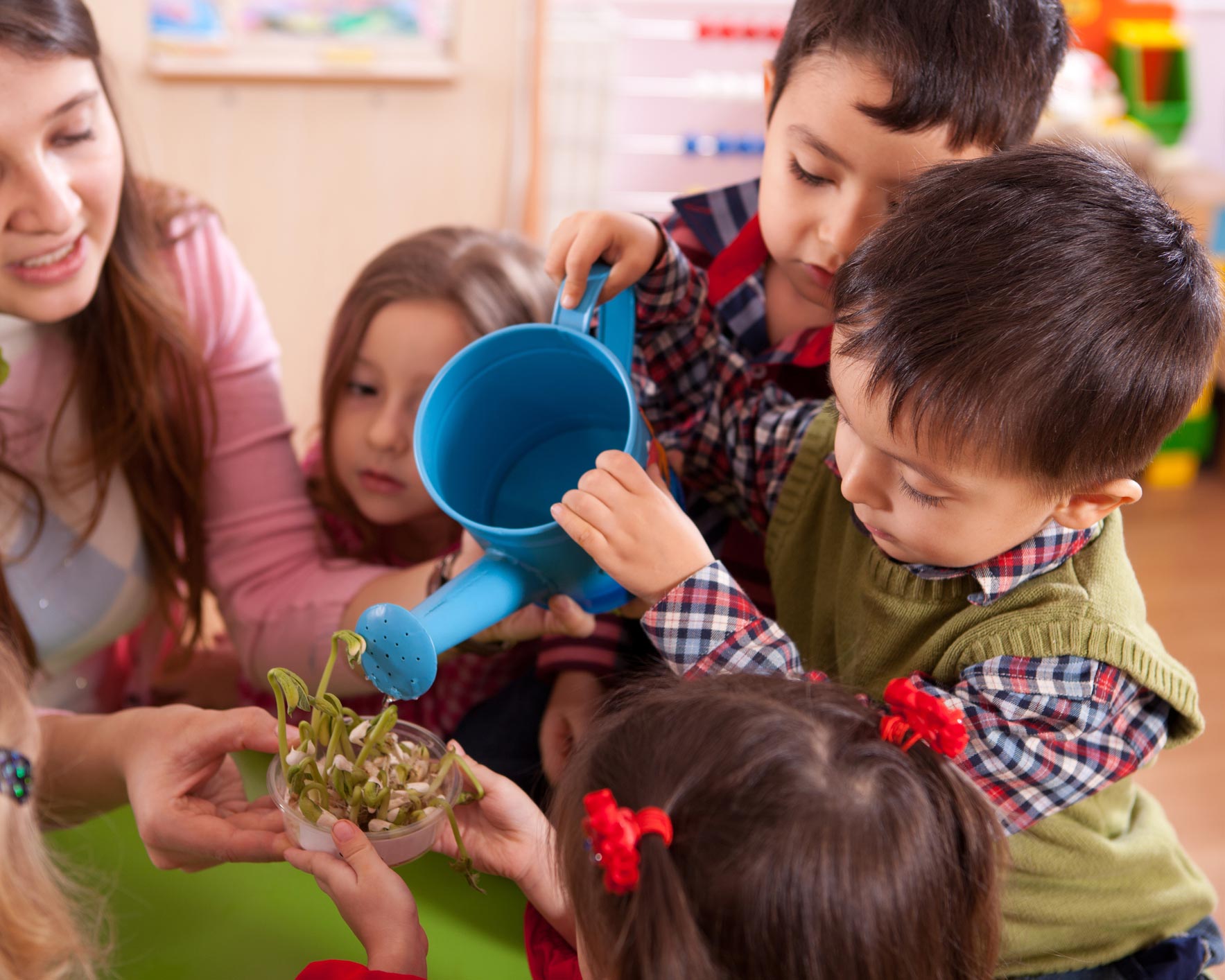 Children Watering Plant — Cottleville, MO — Great Beginnings Day Care And Preschool