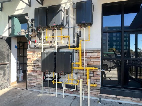A building with a lot of pipes attached to it