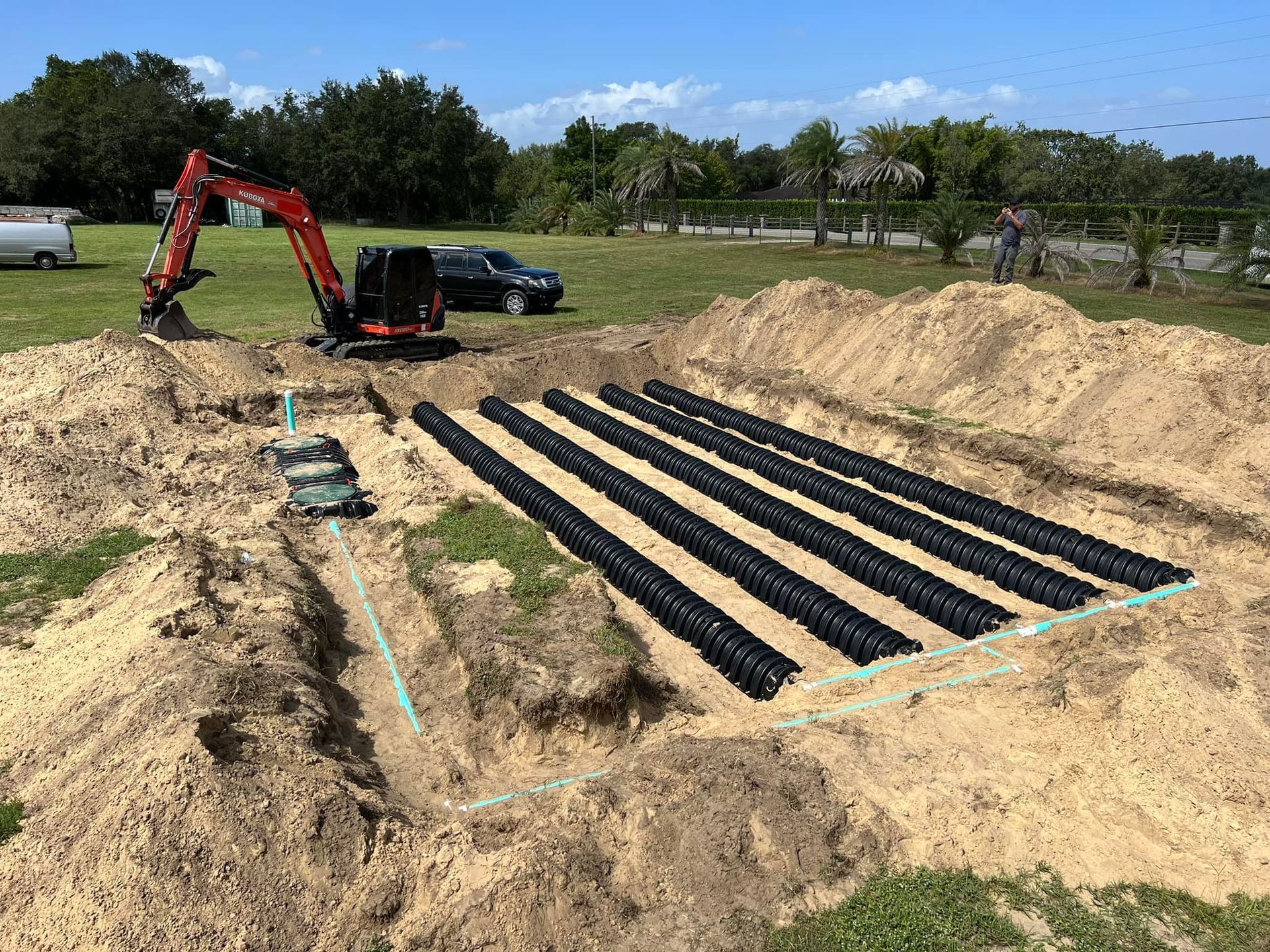 Johnny Jones Plumbing - A septic system is being built in a dirt field.