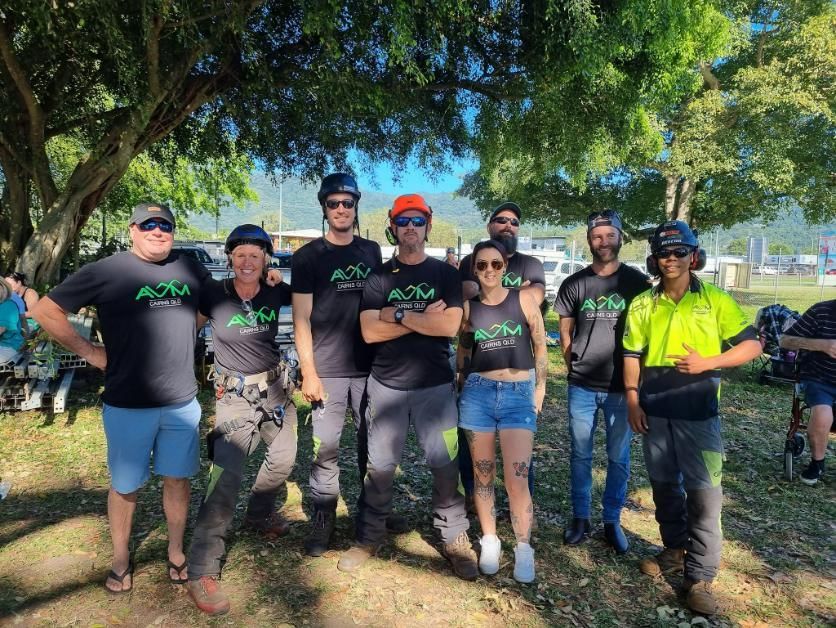A Group of People Are Posing for A Picture in A Park — Advanced Vegetation Management in Stratford, QLD