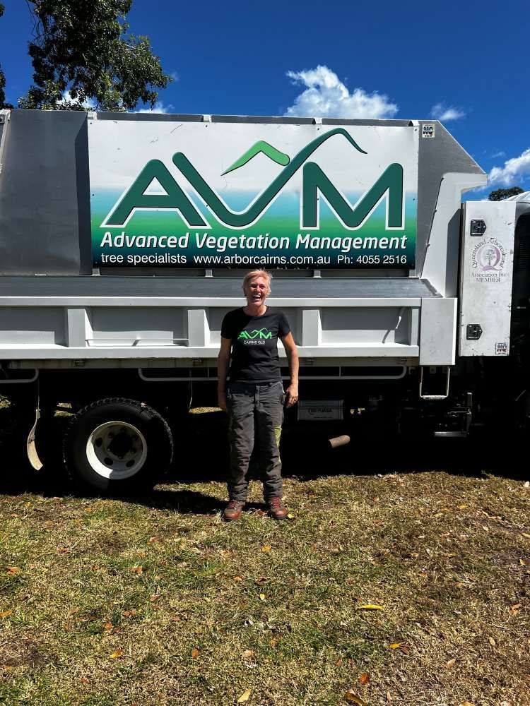 A Man is Standing in Front of a Dump Truck — Advanced Vegetation Management in Stratford, QLD