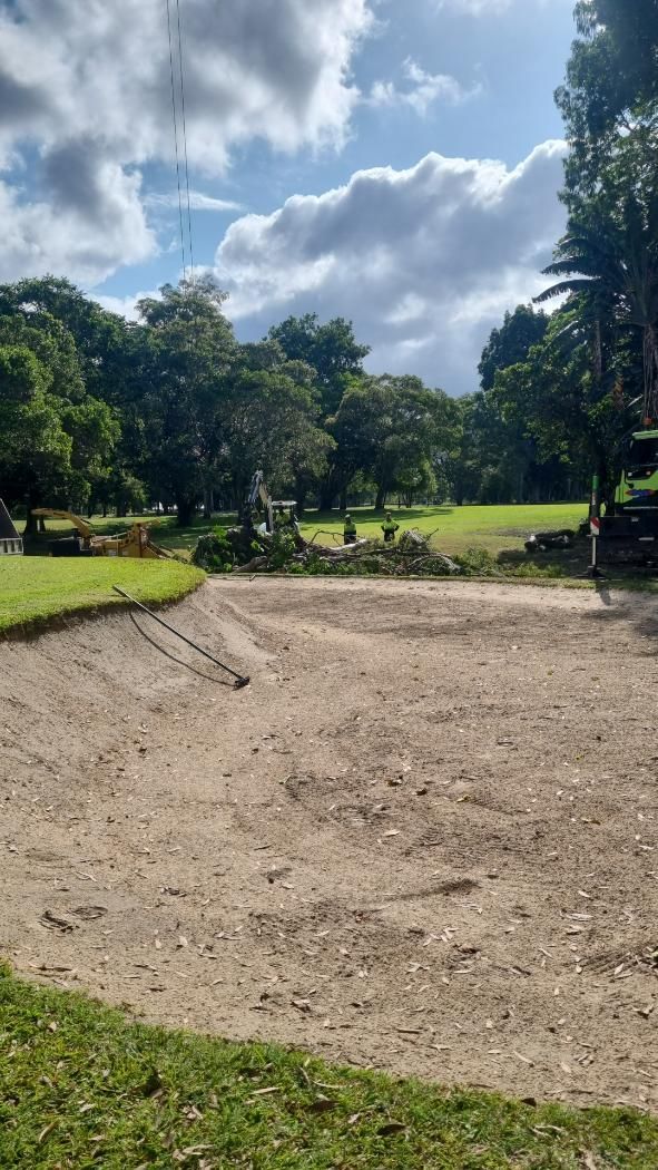 There Is a Dirt Field in The Middle of A Park with Trees in The Background — Advanced Vegetation Management in Stratford, QLD