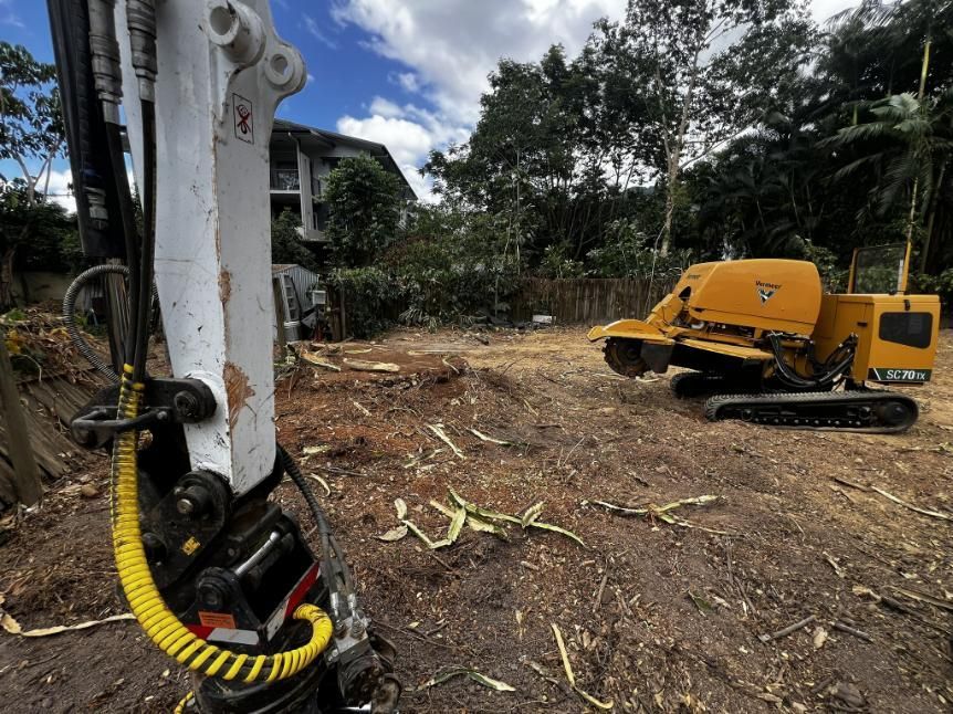 A Yellow and White Machine Is Sitting in A Dirt Field — Advanced Vegetation Management in Stratford, QLD