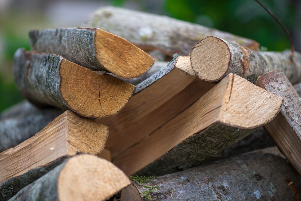 A Pile of Logs Stacked on Top of Each Other — Dubbo Soils & Landscaping Supplies in Narromine, NSW