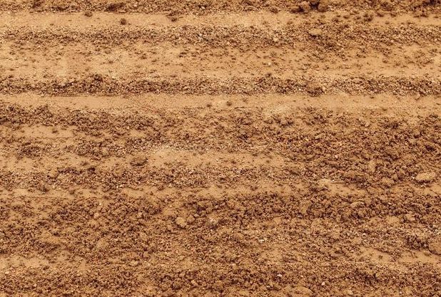 A Close Up of a Soil Surface With a Striped Pattern — Dubbo Soils & Landscaping Supplies in Wellington, NSW