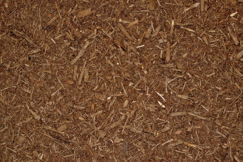 A Close Up of a Pile of Brown Mulch — Dubbo Soils & Landscaping Supplies in Gilgandra, NSW