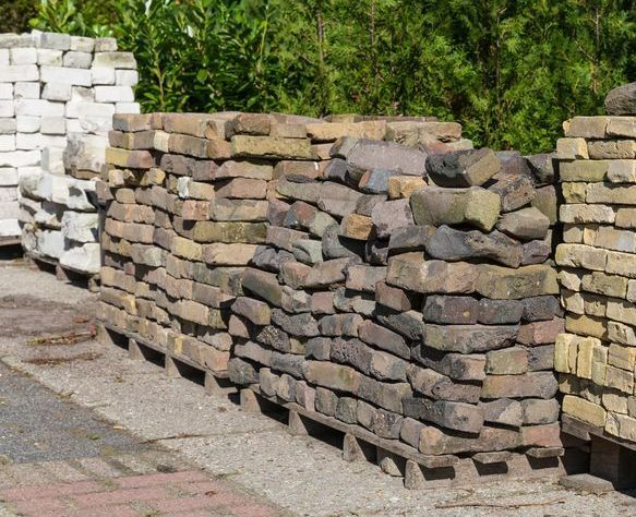 A Row of Bricks Stacked on Top of Each Other on Pallets — Dubbo Soils & Landscaping Supplies in Gilgandra, NSW