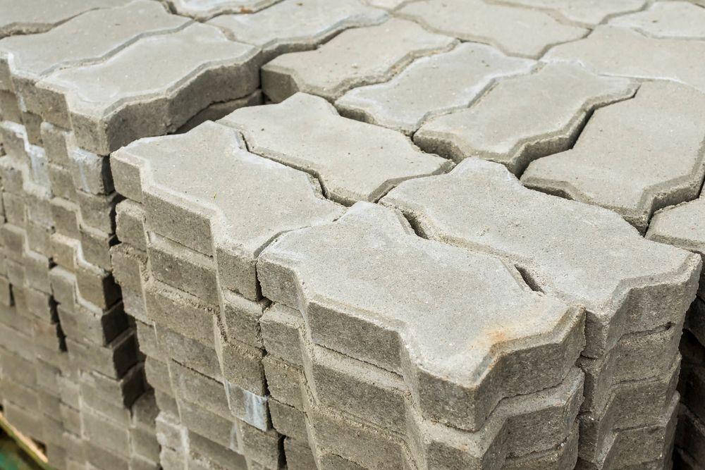 A Pile of Concrete Pavers Stacked on Top of Each Other — Dubbo Soils & Landscaping Supplies in Narromine, NSW