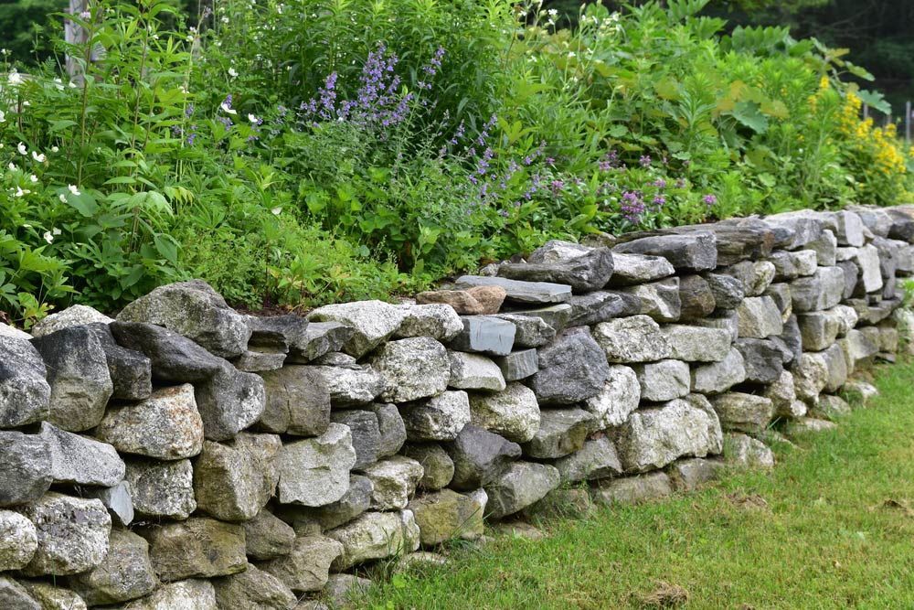 Stone Used for Creating Boundary Wall in Garden — Dubbo Soils & Landscaping Supplies in Dubbo, NSW