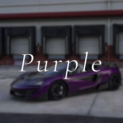 A purple car is parked in front of a building that says purple