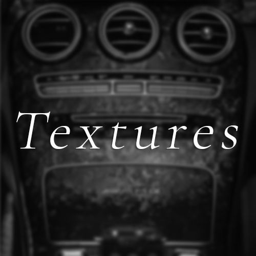 A black and white photo of a car dashboard that says textures