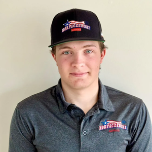 Man wearing a cap and polo shirt with 