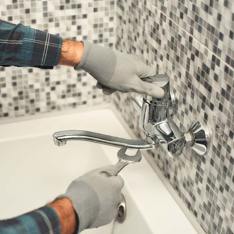 Fixing Faucet In A Bathroom — Medford, OR — Cowboy Plumbing LLC