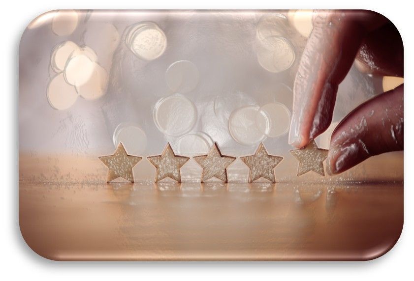 A person is putting a star in the middle of a row of stars