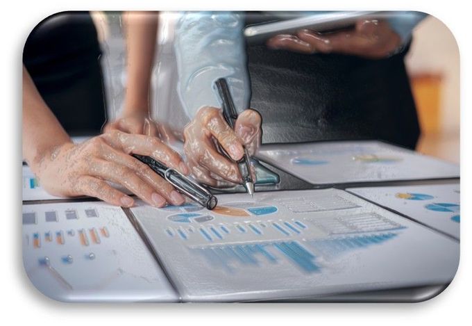 A person is writing on a piece of paper with a pen.