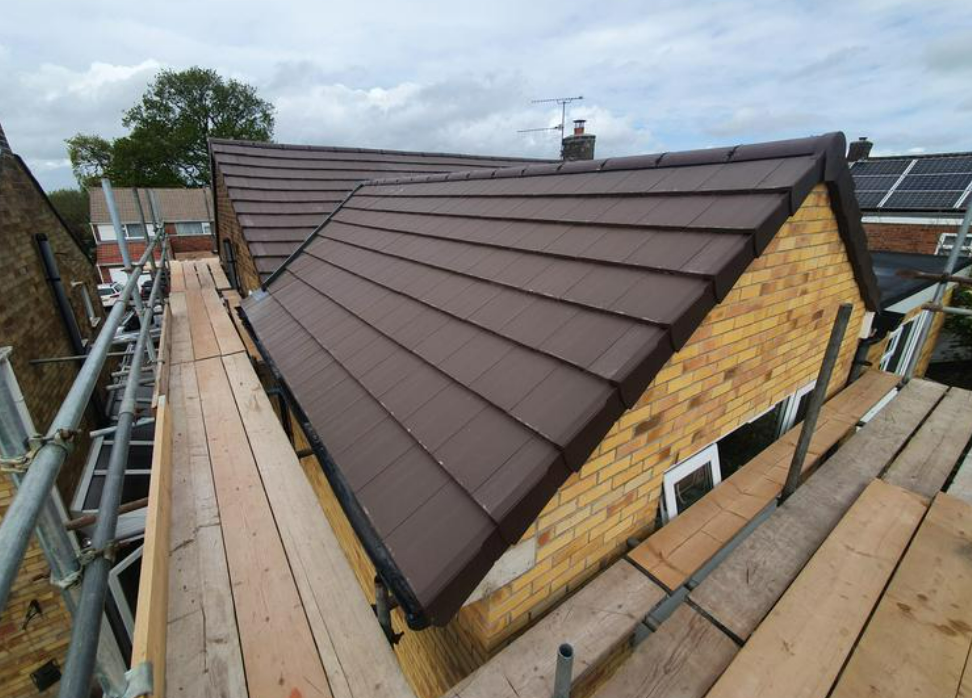 Picture of a new concrete tile bungalow roof by Roofers London.