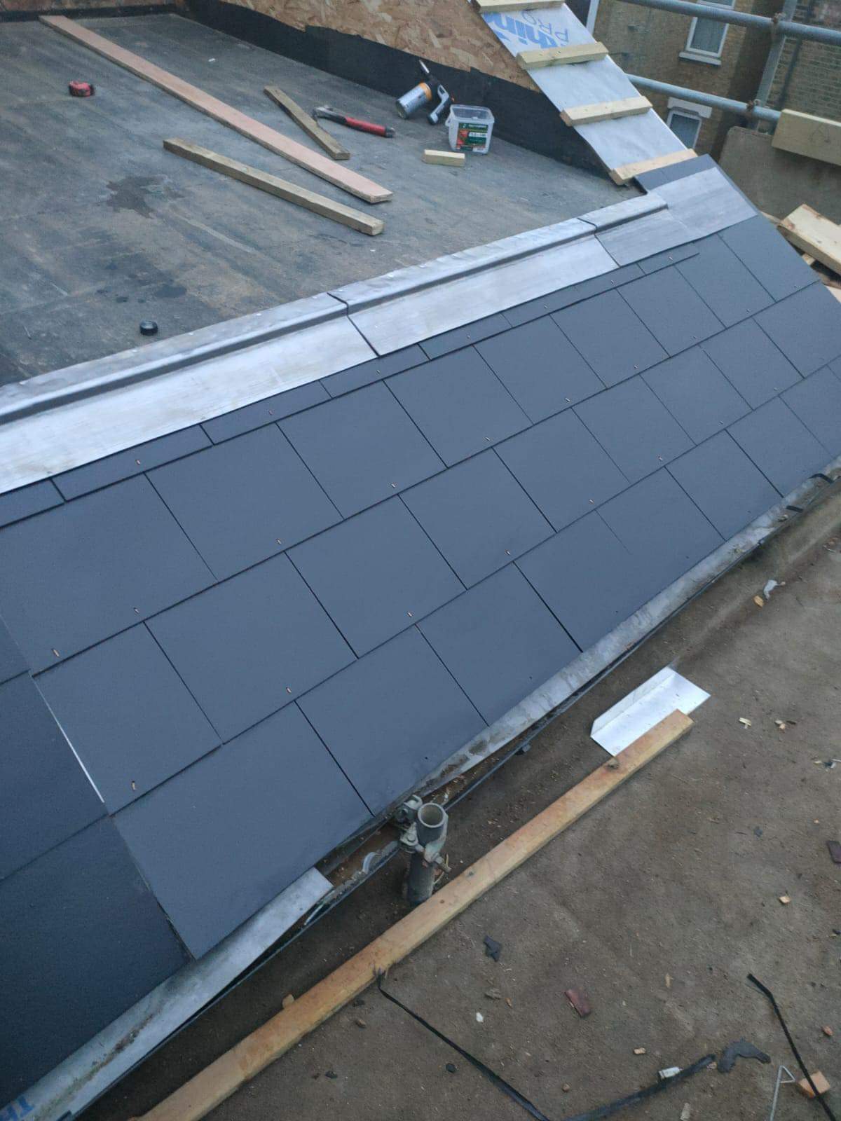 Picture of a new synthetic slate roof fitted by Roofers London