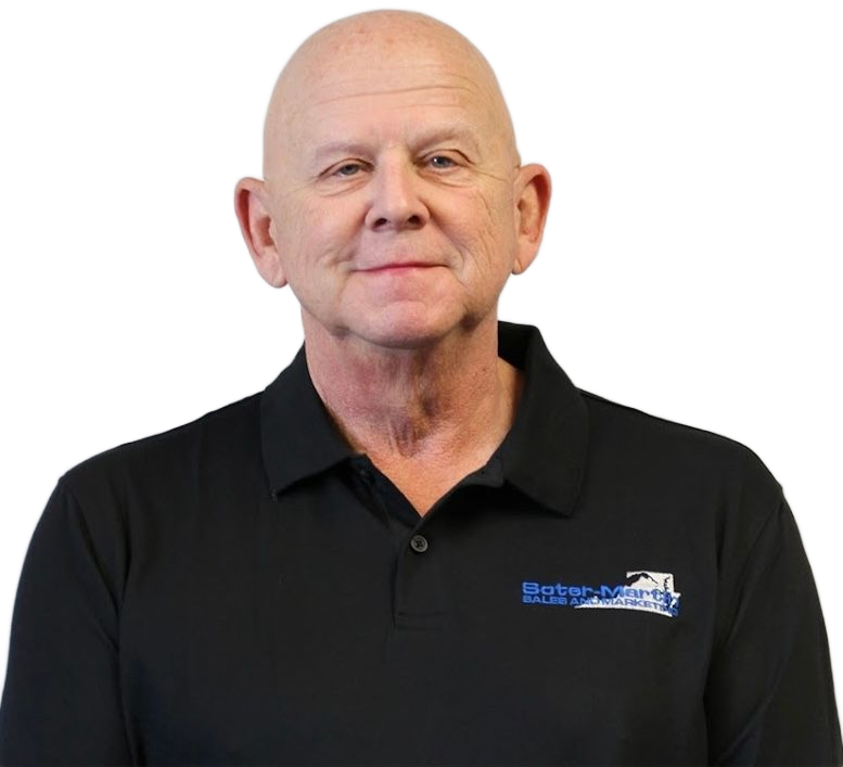 A bald man wearing a black shirt with a blue logo on the front