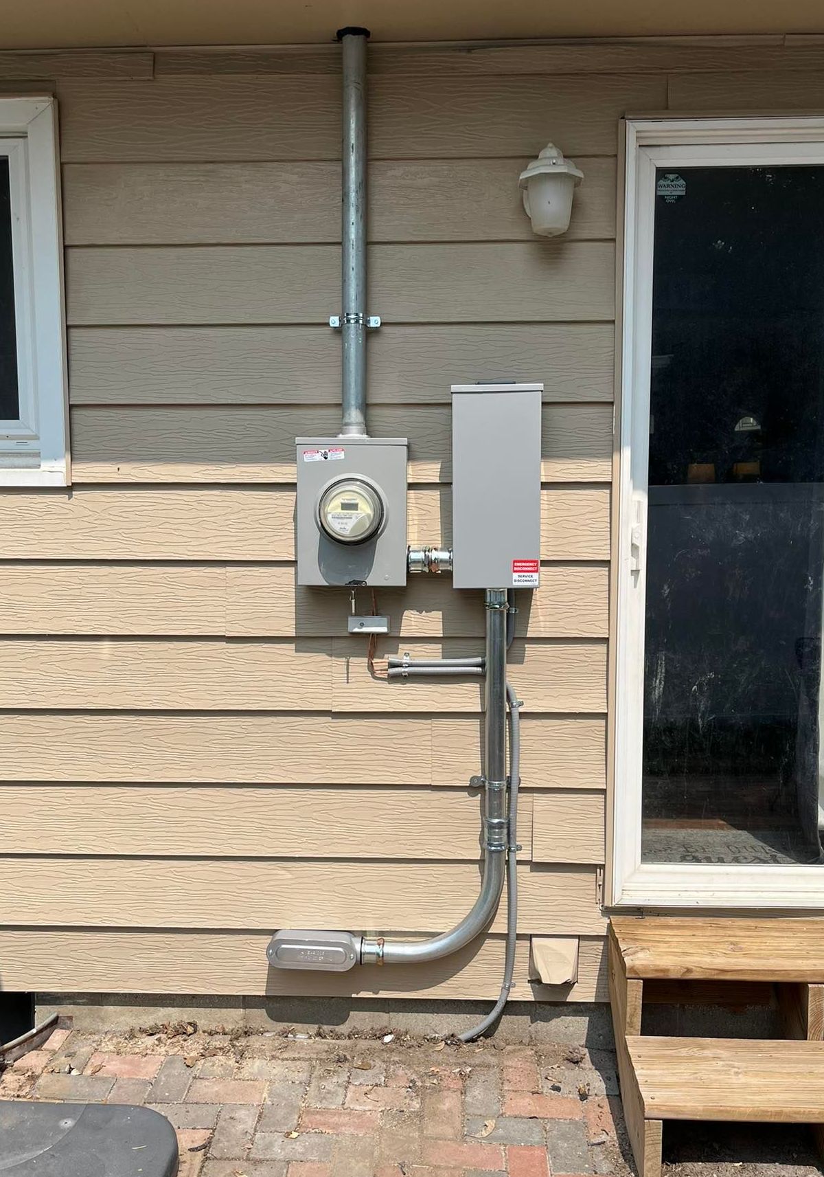 There is a meter on the side of a house.