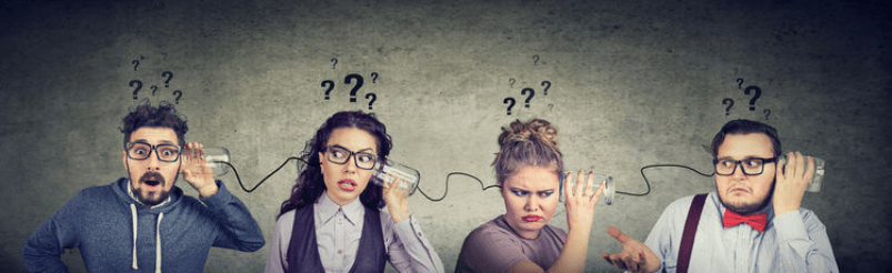 A group of people are covering their ears with their hands while talking on a cell phone