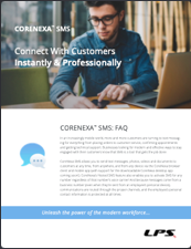 A man is sitting at a table using a laptop computer