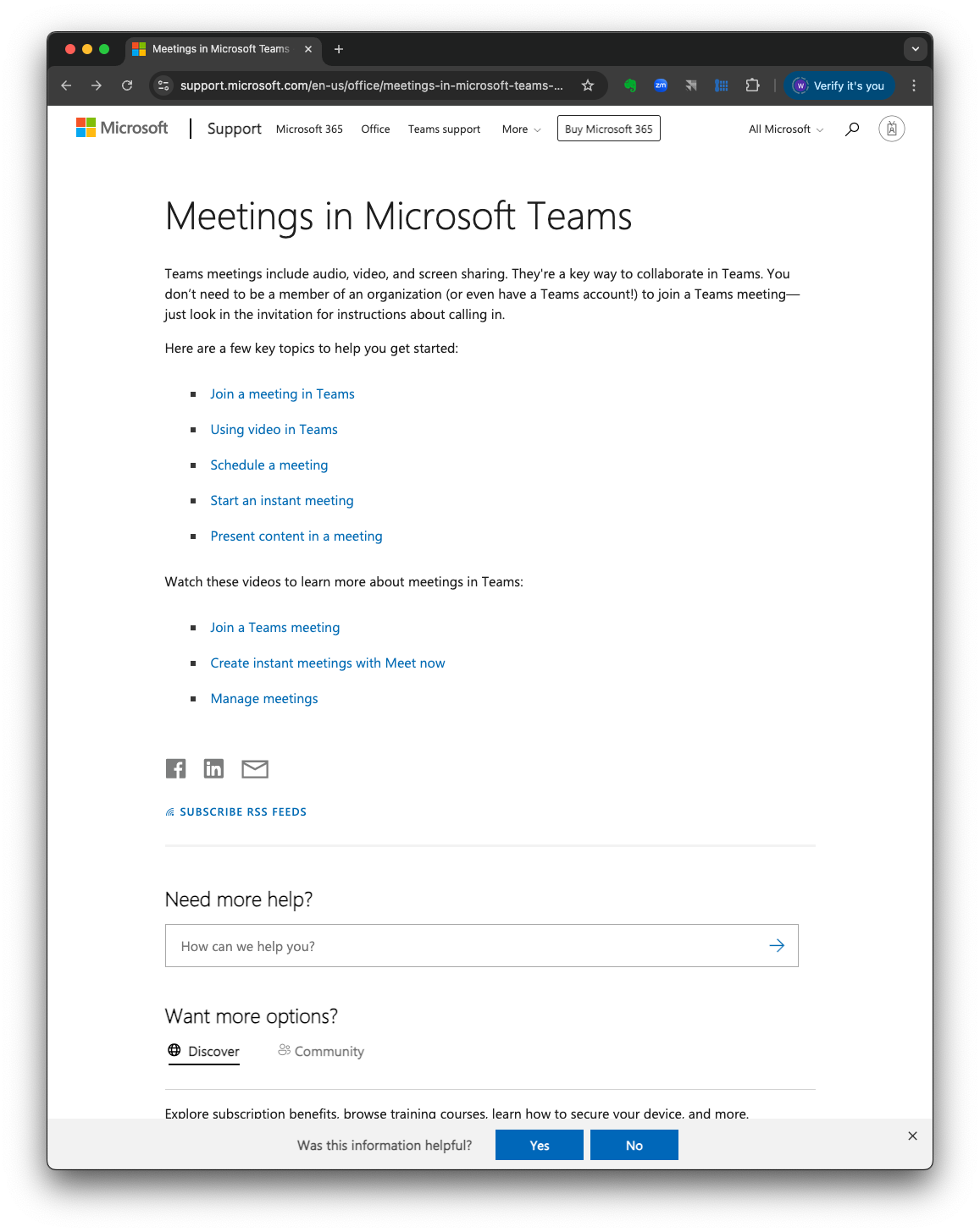 A woman wearing glasses is looking at her cell phone