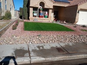 A pile of dirt with a tree in the background.