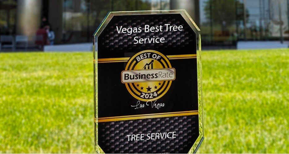 A plaque that says vegas best tree service on it.