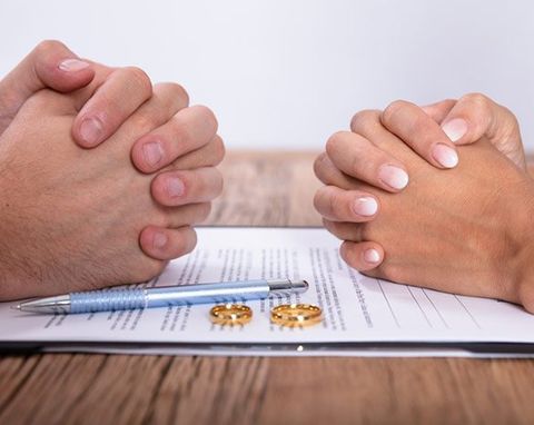 Couple's Hand With Divorce Agreement — Pulaski, VA — Gilmer Sadler Attorneys