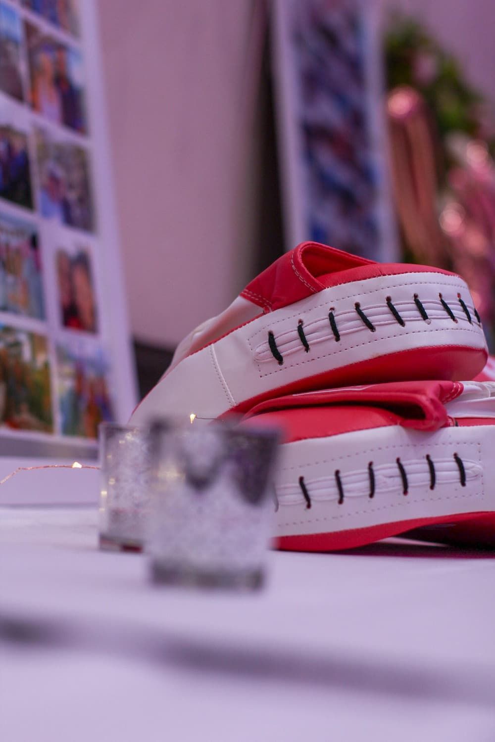 A pair of red and white boxing gloves on a table - Funeral Services in Upper Coomera, QLD