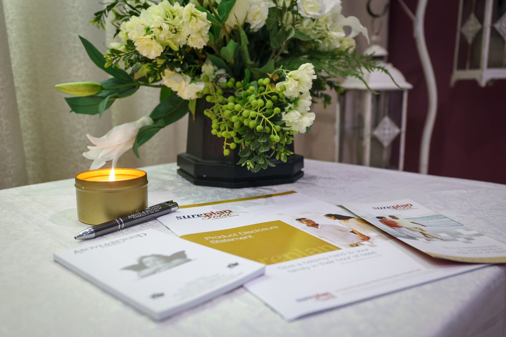 A group of men are carrying a coffin in front of a sign that says better than ready - Funeral Services in Upper Coomera, QLD