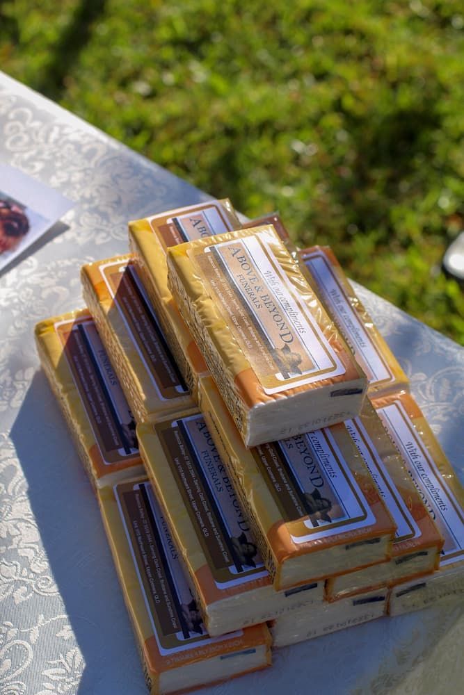 A stack of laroche & berard chocolate bars on a table - Funeral Services in Upper Coomera, QLD