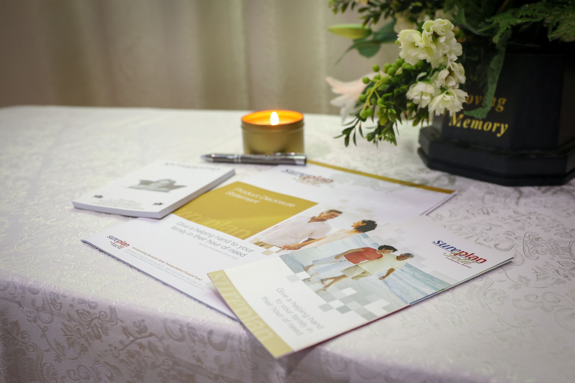 A teddy bear wearing headphones is sitting in a coffin - Funeral Services in Upper Coomera, QLD